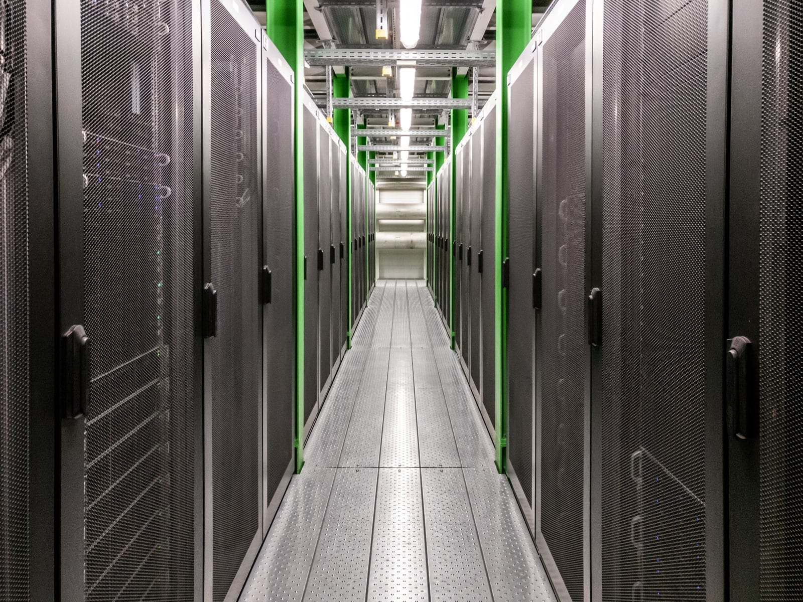 Cold aisle between two rows of closed server cabinets