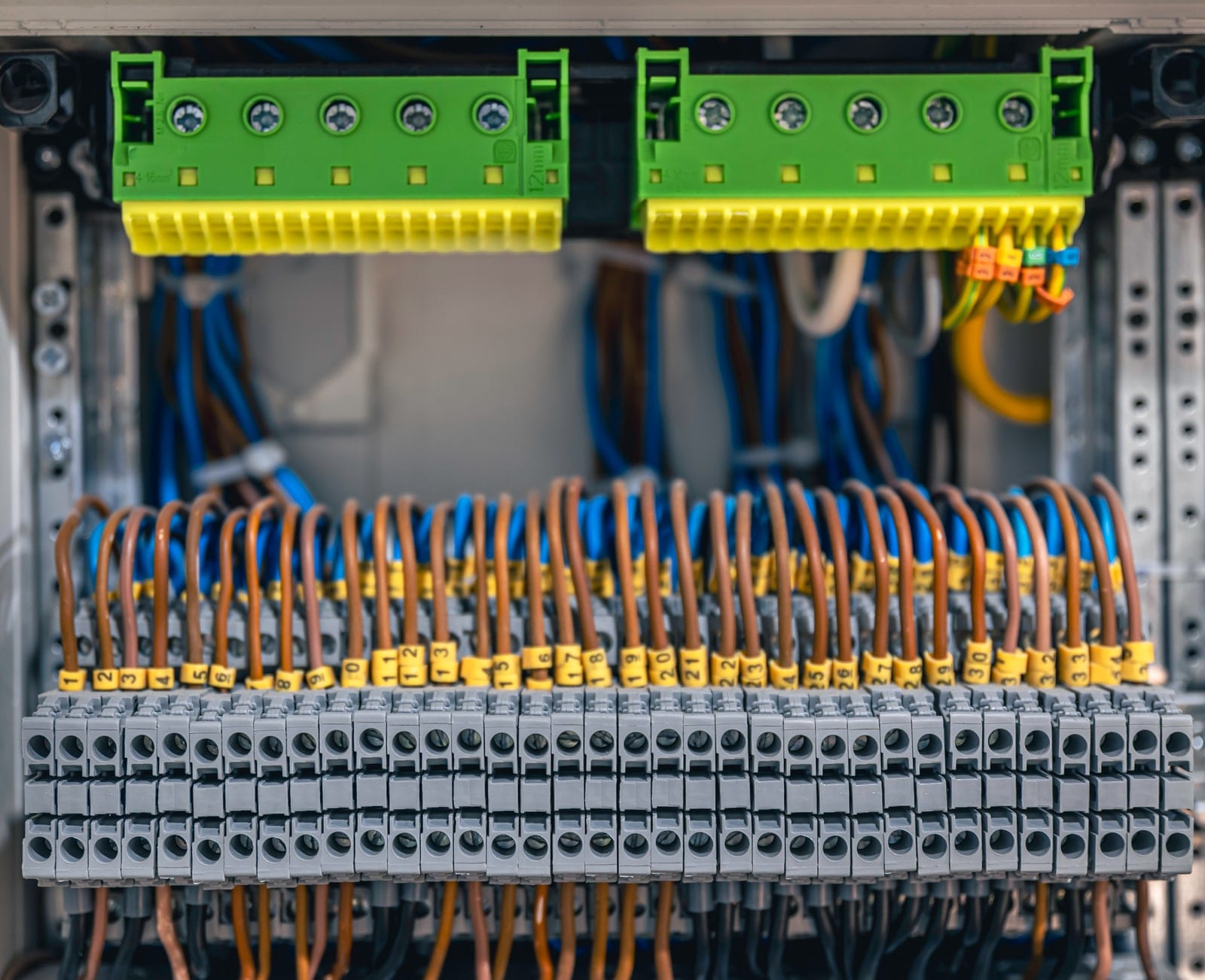 Terminal blocks, fuses and contactors wired inside a control panel